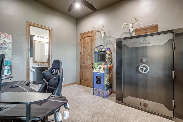 home office with ceiling fan and carpet