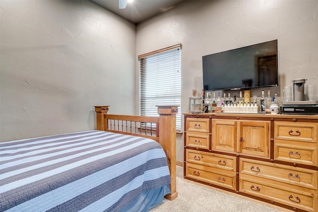 bedroom featuring light colored carpet