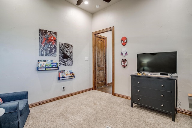 sitting room with light carpet and ceiling fan