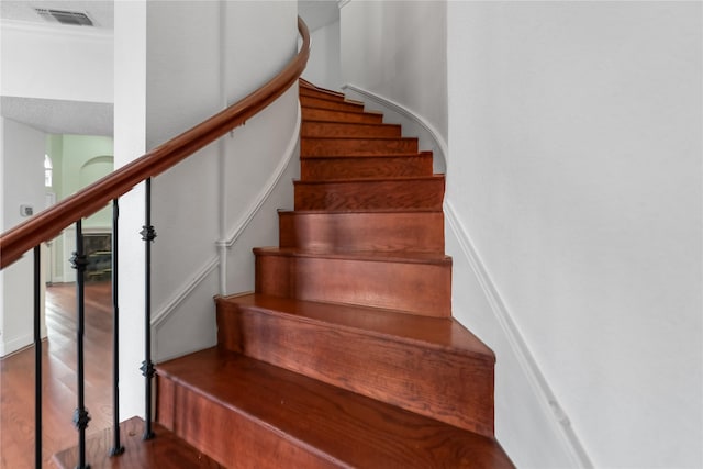 stairway featuring hardwood / wood-style flooring