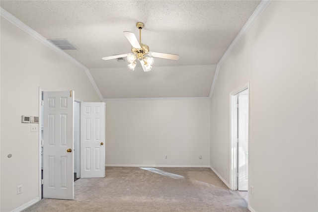 bonus room featuring lofted ceiling, a textured ceiling, light colored carpet, and ceiling fan