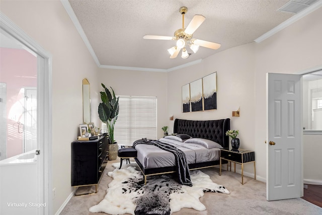 bedroom with a textured ceiling, light carpet, and ornamental molding