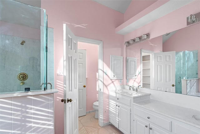 bathroom featuring lofted ceiling, an enclosed shower, vanity, tile patterned floors, and toilet