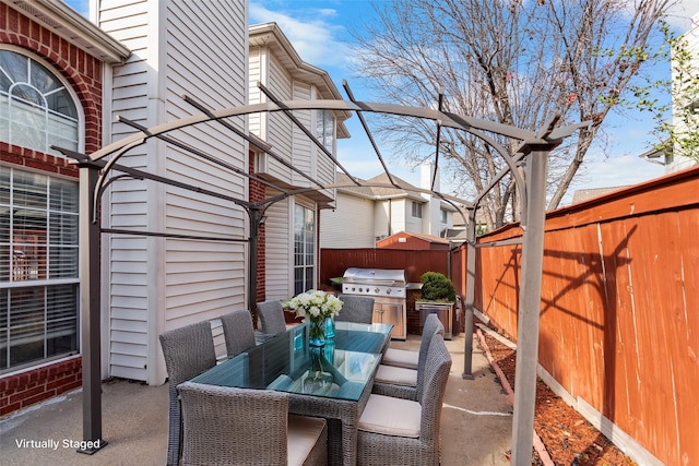 view of patio featuring a grill