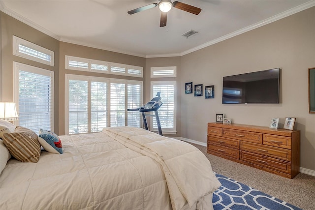 carpeted bedroom with crown molding and ceiling fan