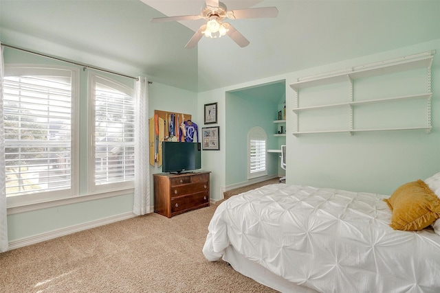 bedroom with carpet, lofted ceiling, and ceiling fan