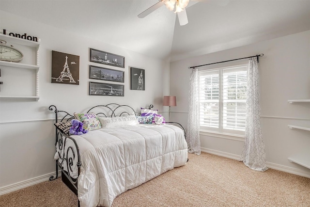 carpeted bedroom with vaulted ceiling and ceiling fan