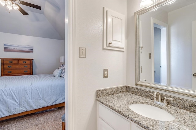 bathroom featuring lofted ceiling, vanity, and ceiling fan