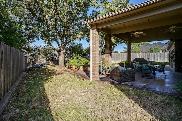 view of yard with an outdoor hangout area, a patio area, and ceiling fan