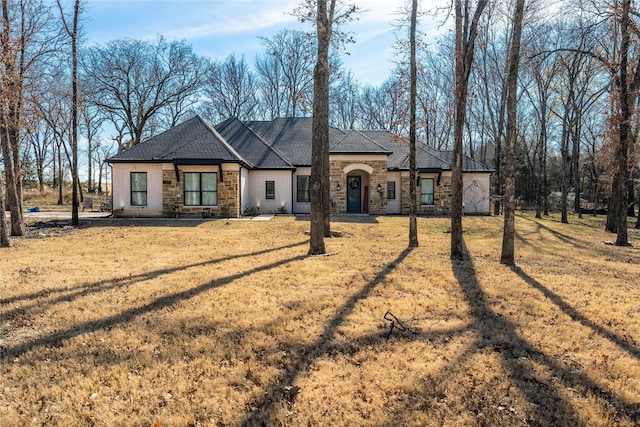 ranch-style home with a front yard