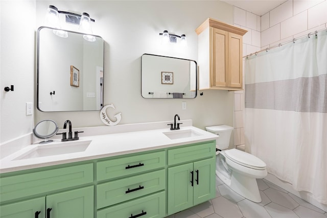 bathroom with tile patterned floors, vanity, toilet, and curtained shower