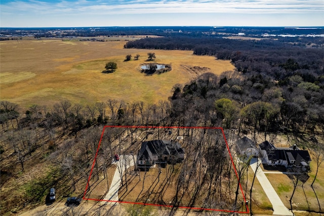 birds eye view of property with a rural view