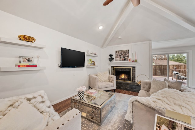 living room featuring a tile fireplace, high vaulted ceiling, hardwood / wood-style floors, and beam ceiling