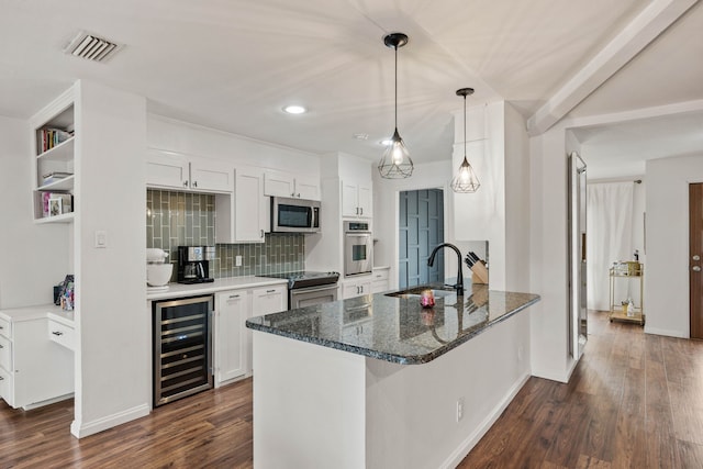 kitchen featuring white cabinetry, sink, wine cooler, kitchen peninsula, and stainless steel appliances