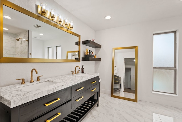 bathroom with vanity and plenty of natural light