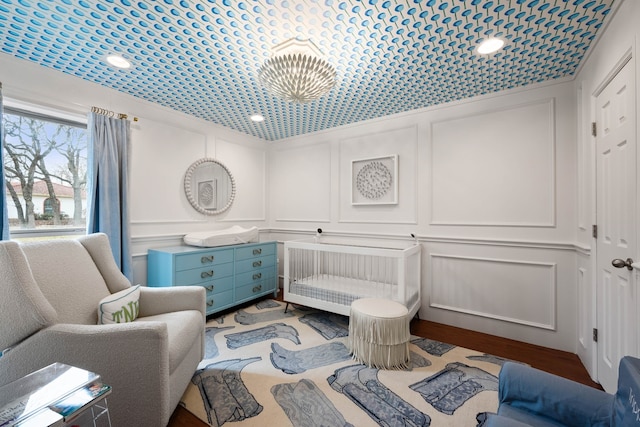 sitting room with hardwood / wood-style flooring