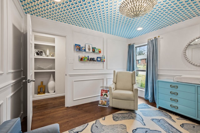 sitting room with dark hardwood / wood-style floors