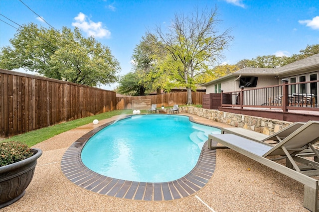 view of swimming pool featuring a diving board