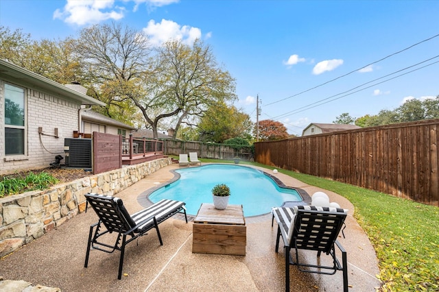 view of swimming pool with a patio area