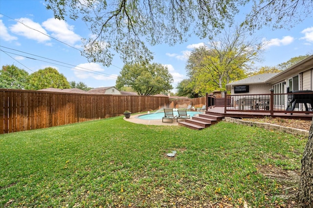 view of yard with a pool side deck