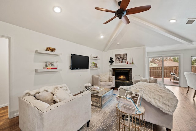 living room with vaulted ceiling with beams, wood-type flooring, and ceiling fan