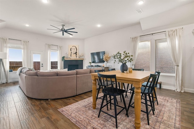 dining room featuring ceiling fan and dark hardwood / wood-style flooring