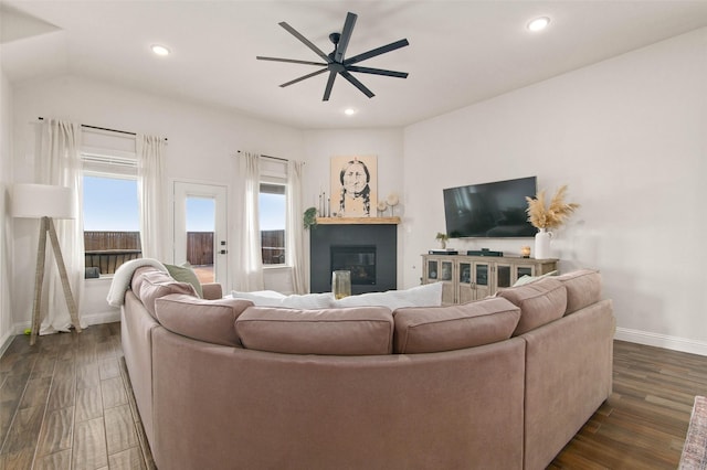 living room with dark hardwood / wood-style floors and ceiling fan