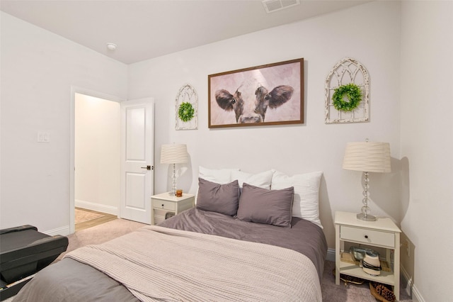 bedroom featuring light carpet