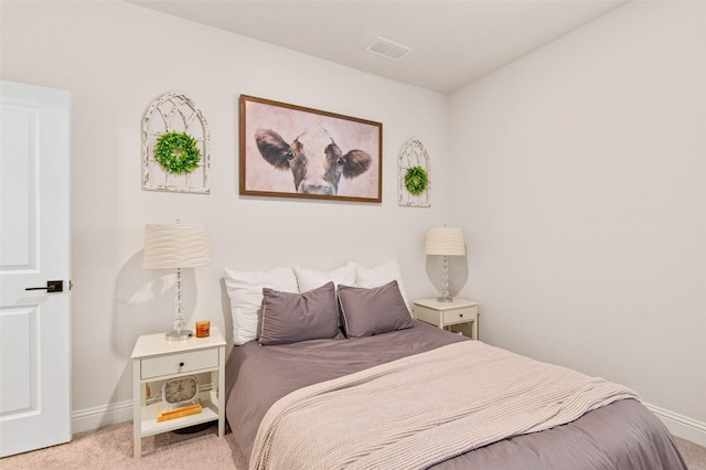 bedroom with light colored carpet