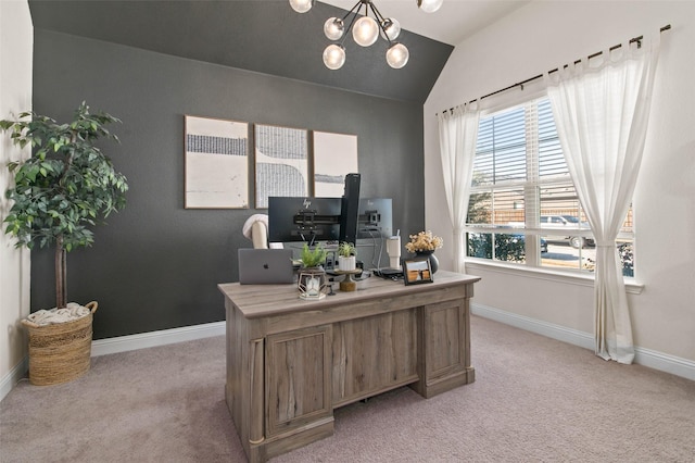 carpeted office space featuring lofted ceiling and an inviting chandelier