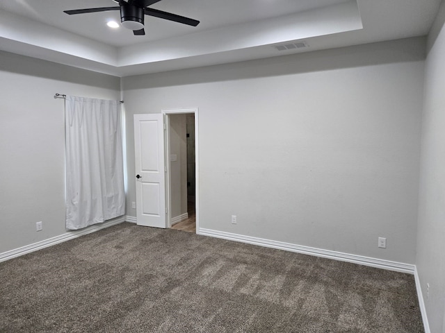 spare room with ceiling fan and carpet floors