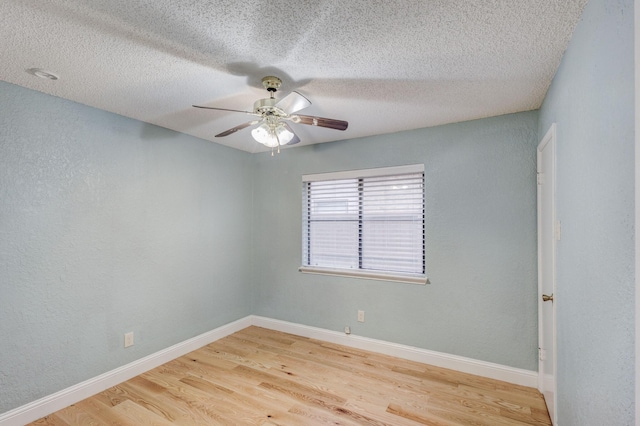 unfurnished room with hardwood / wood-style flooring, a textured ceiling, and ceiling fan