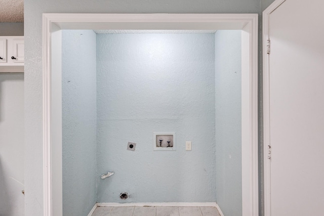 clothes washing area with washer hookup, hookup for an electric dryer, and light tile patterned floors