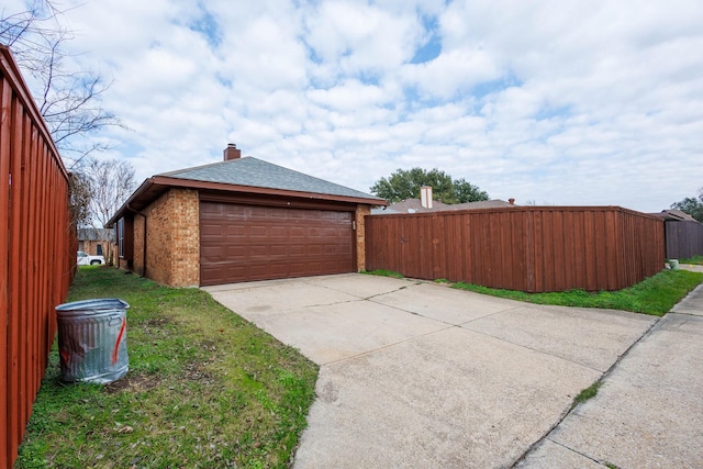 garage with a yard