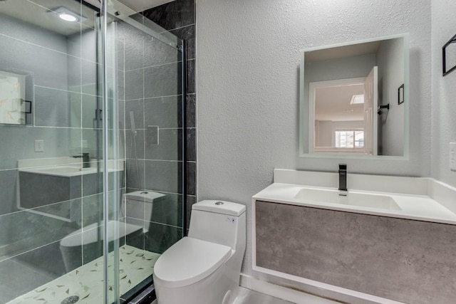 bathroom featuring walk in shower, vanity, and toilet