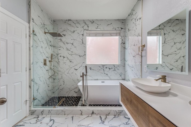 bathroom featuring vanity and shower with separate bathtub