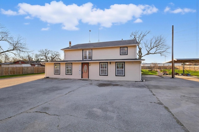 back of property with fence