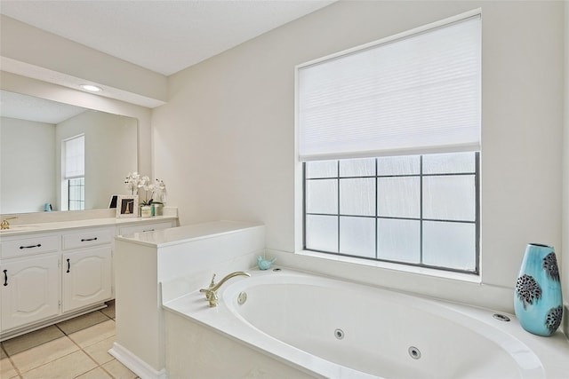 bathroom with vanity, a washtub, tile patterned floors, and a textured ceiling