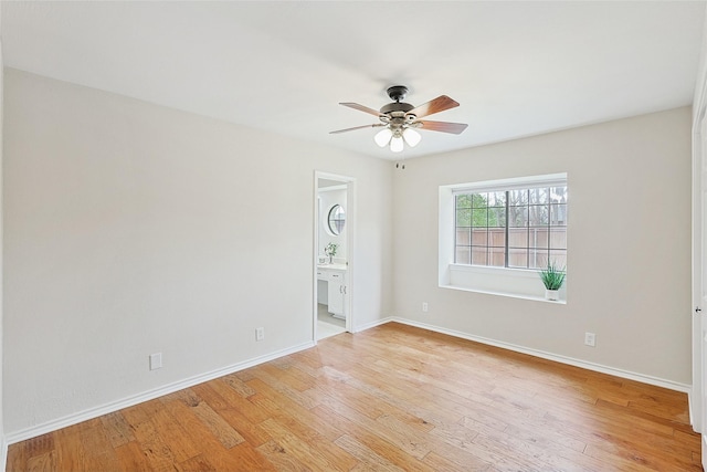 spare room featuring light hardwood / wood-style floors and ceiling fan