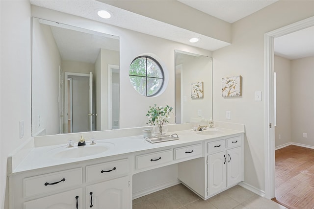 bathroom with vanity and tile patterned flooring