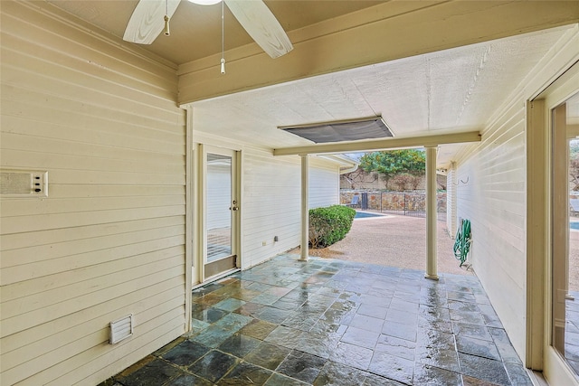 view of patio featuring ceiling fan