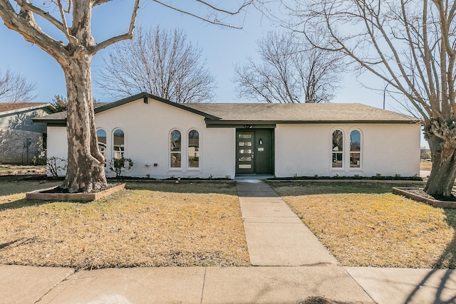 ranch-style house with a front yard