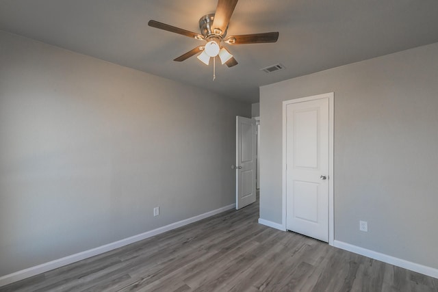 unfurnished bedroom featuring ceiling fan and light wood-type flooring