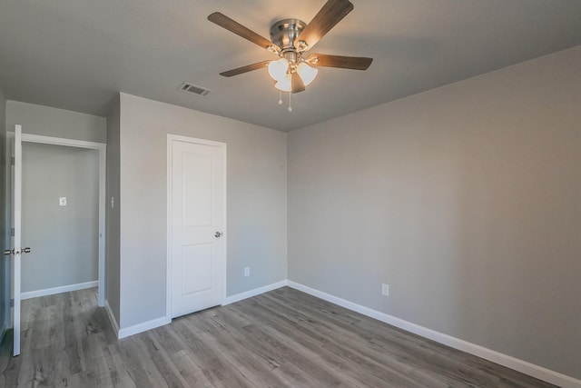 unfurnished bedroom with light hardwood / wood-style flooring and ceiling fan