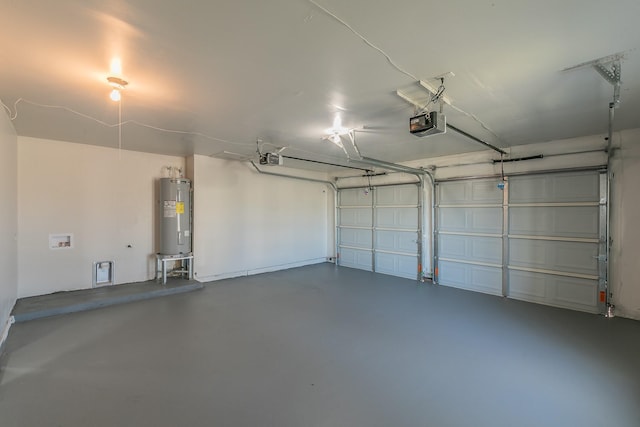 garage with water heater and a garage door opener