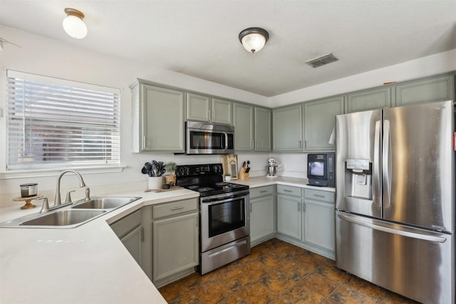 kitchen featuring stainless steel appliances and sink