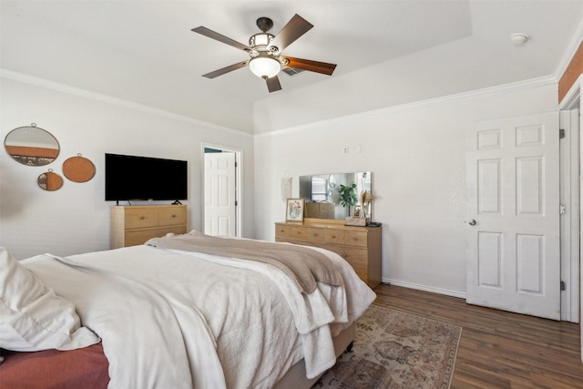 bedroom featuring crown molding, dark hardwood / wood-style floors, and ceiling fan