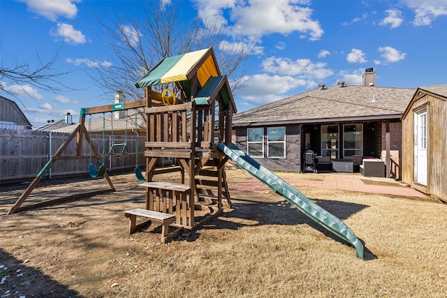 view of jungle gym featuring a patio