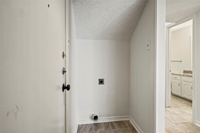 clothes washing area featuring hookup for an electric dryer