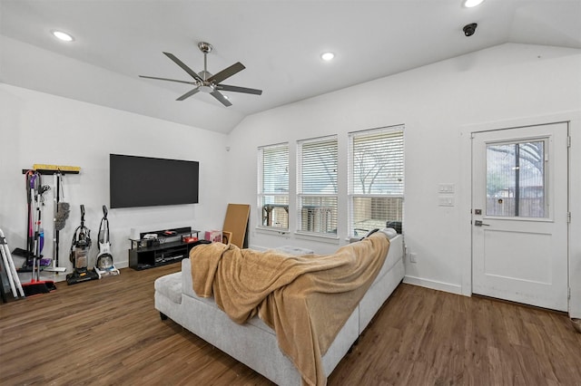 living room with lofted ceiling, dark wood-type flooring, and ceiling fan